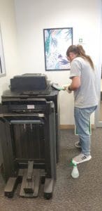 Student Cleaning Photocopier