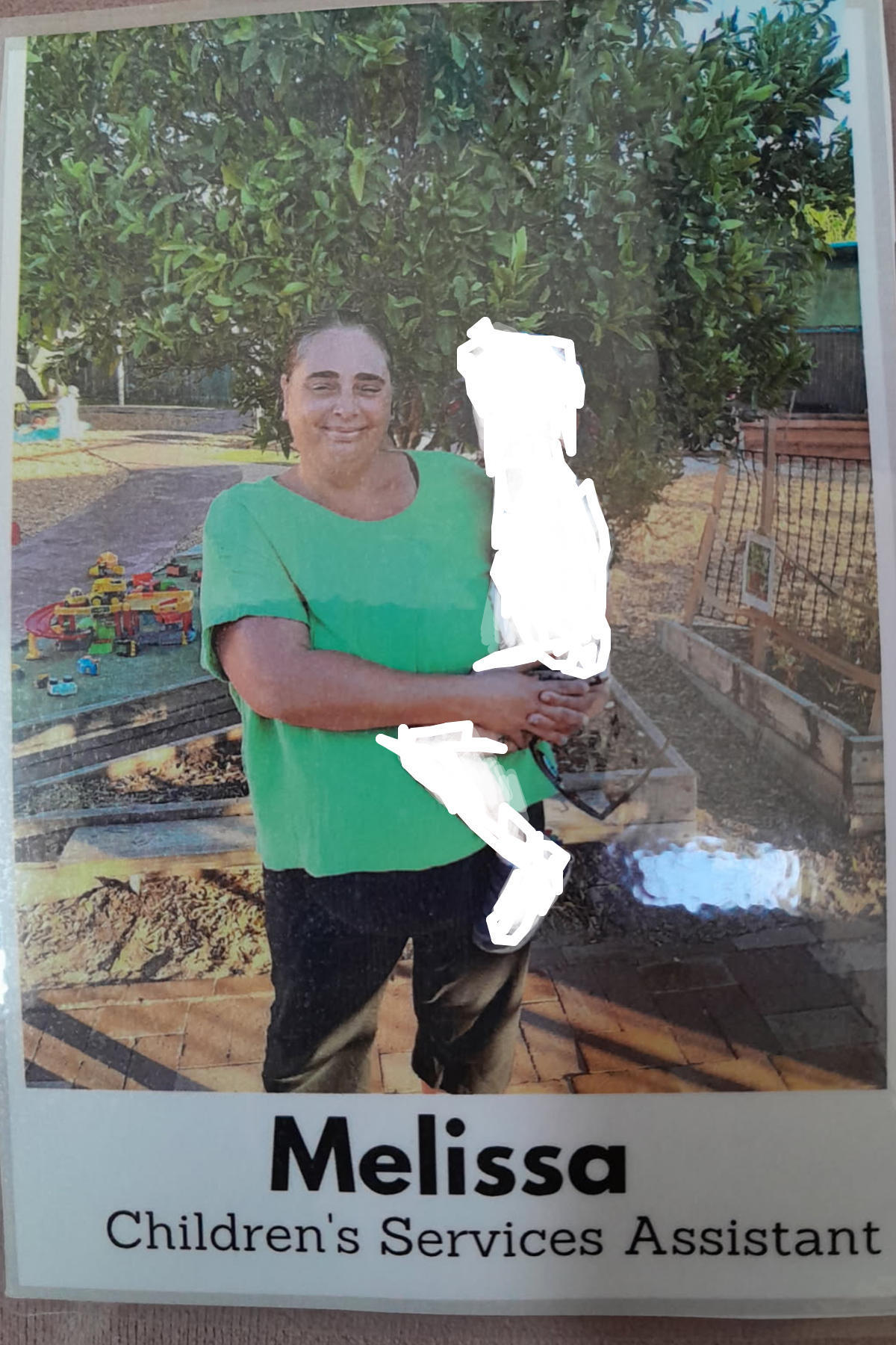 Staff photo with a cropped out Child