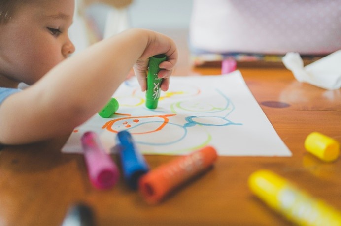 A baby drawing on paper