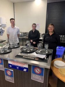Three students pictured at practical skills training Food and Beverage