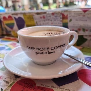 Coffee Cup reads "The Note Coffee post it love"